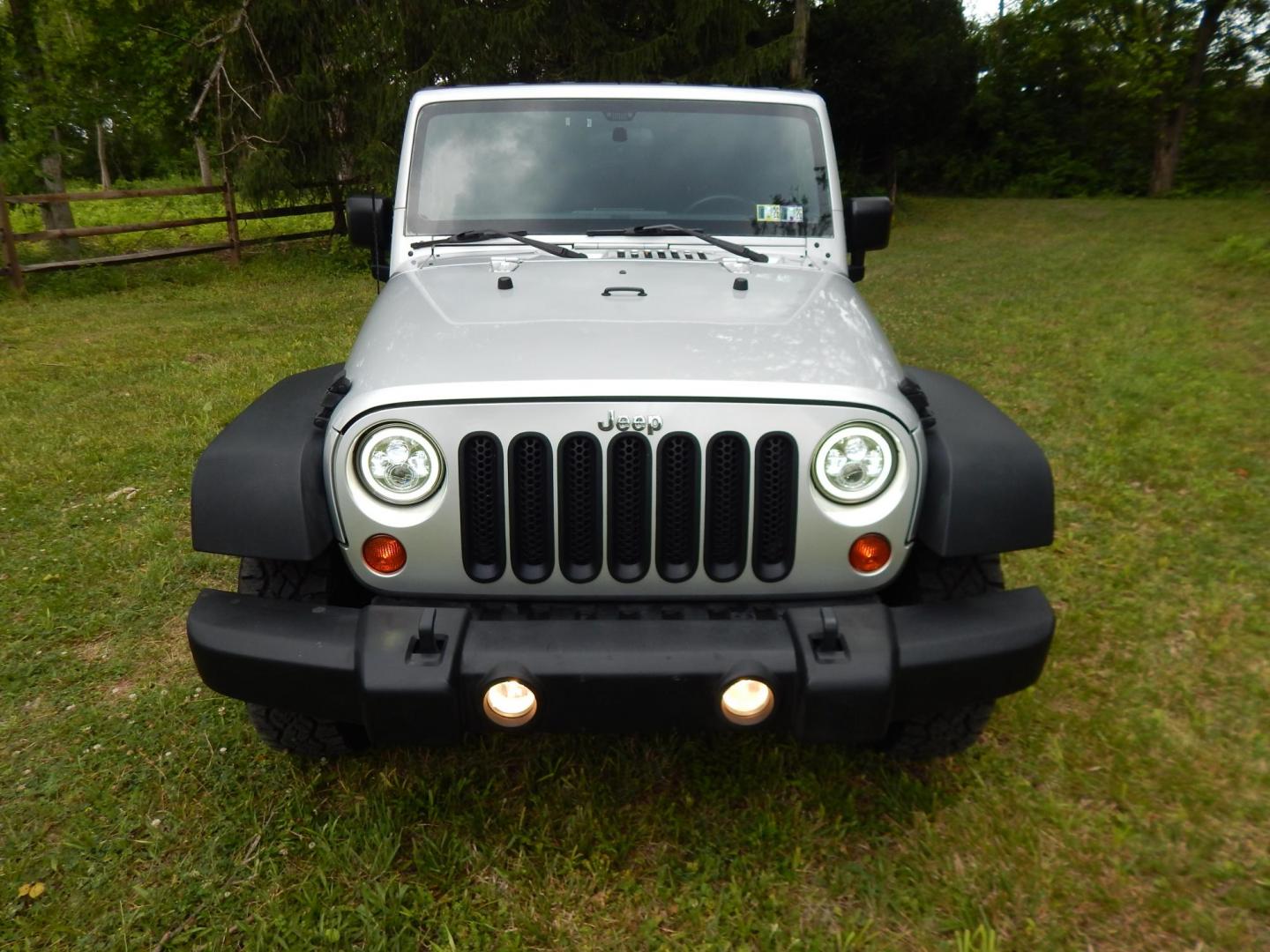 2011 Silver /Black Jeep Wrangler Sport 4WD (1J4AA2D12BL) with an 3.8L V6 OHV 12V engine, Automatic transmission, located at 6528 Lower York Road, New Hope, PA, 18938, (215) 862-9555, 40.358707, -74.977882 - Here we have a 2011 Jeep Wrangler Sport with a 3.8L V6 putting power to an automatic 4x4 transmission. Options include: black cloth, heat and AC, JVC aftermarket radio, cruise control, tilt steering wheel, 3 piece hard top, power windows/locks/mirrors, 17 inch alloy wheels with 4 Goodyear Wrangler t - Photo#7