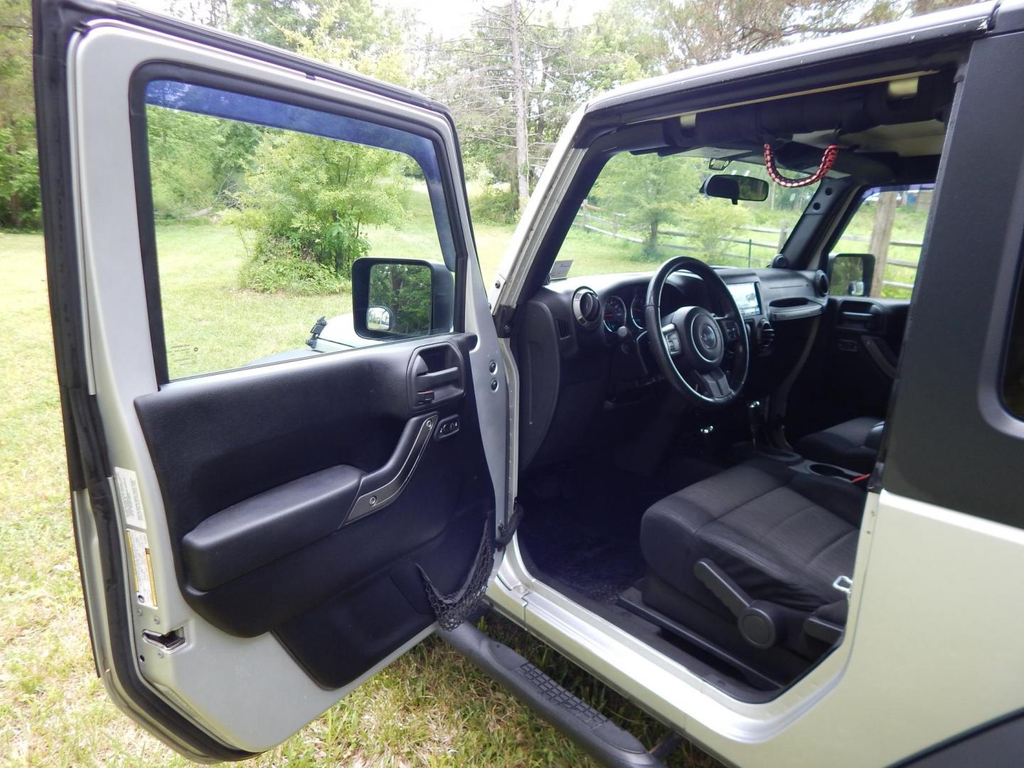 2011 Silver /Black Jeep Wrangler Sport 4WD (1J4AA2D12BL) with an 3.8L V6 OHV 12V engine, Automatic transmission, located at 6528 Lower York Road, New Hope, PA, 18938, (215) 862-9555, 40.358707, -74.977882 - Here we have a 2011 Jeep Wrangler Sport with a 3.8L V6 putting power to an automatic 4x4 transmission. Options include: black cloth, heat and AC, JVC aftermarket radio, cruise control, tilt steering wheel, 3 piece hard top, power windows/locks/mirrors, 17 inch alloy wheels with 4 Goodyear Wrangler t - Photo#8