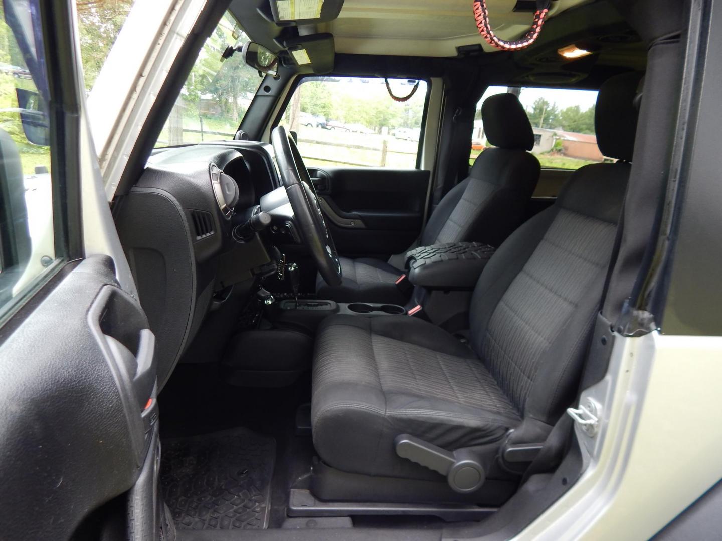 2011 Silver /Black Jeep Wrangler Sport 4WD (1J4AA2D12BL) with an 3.8L V6 OHV 12V engine, Automatic transmission, located at 6528 Lower York Road, New Hope, PA, 18938, (215) 862-9555, 40.358707, -74.977882 - Here we have a 2011 Jeep Wrangler Sport with a 3.8L V6 putting power to an automatic 4x4 transmission. Options include: black cloth, heat and AC, JVC aftermarket radio, cruise control, tilt steering wheel, 3 piece hard top, power windows/locks/mirrors, 17 inch alloy wheels with 4 Goodyear Wrangler t - Photo#9