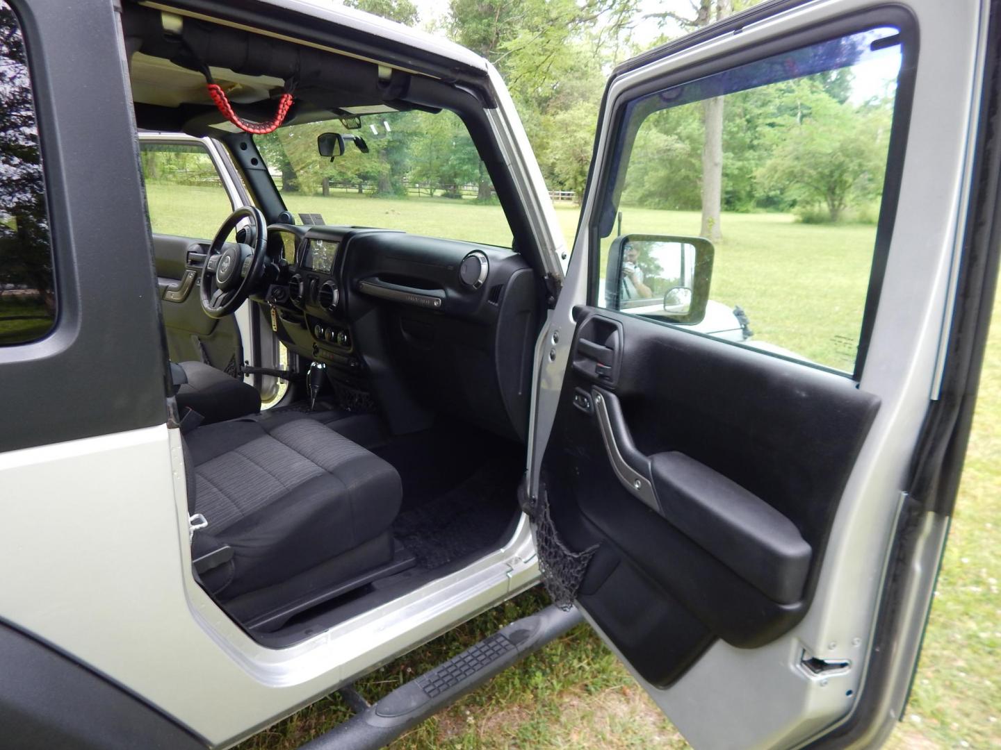 2011 Silver /Black Jeep Wrangler Sport 4WD (1J4AA2D12BL) with an 3.8L V6 OHV 12V engine, Automatic transmission, located at 6528 Lower York Road, New Hope, PA, 18938, (215) 862-9555, 40.358707, -74.977882 - Here we have a 2011 Jeep Wrangler Sport with a 3.8L V6 putting power to an automatic 4x4 transmission. Options include: black cloth, heat and AC, JVC aftermarket radio, cruise control, tilt steering wheel, 3 piece hard top, power windows/locks/mirrors, 17 inch alloy wheels with 4 Goodyear Wrangler t - Photo#14