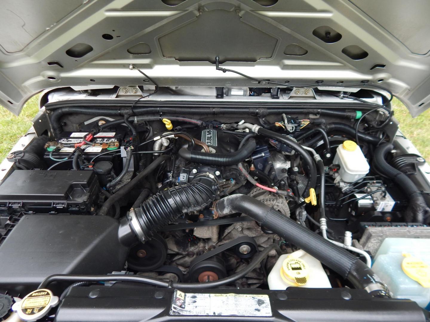2011 Silver /Black Jeep Wrangler Sport 4WD (1J4AA2D12BL) with an 3.8L V6 OHV 12V engine, Automatic transmission, located at 6528 Lower York Road, New Hope, PA, 18938, (215) 862-9555, 40.358707, -74.977882 - Here we have a 2011 Jeep Wrangler Sport with a 3.8L V6 putting power to an automatic 4x4 transmission. Options include: black cloth, heat and AC, JVC aftermarket radio, cruise control, tilt steering wheel, 3 piece hard top, power windows/locks/mirrors, 17 inch alloy wheels with 4 Goodyear Wrangler t - Photo#20