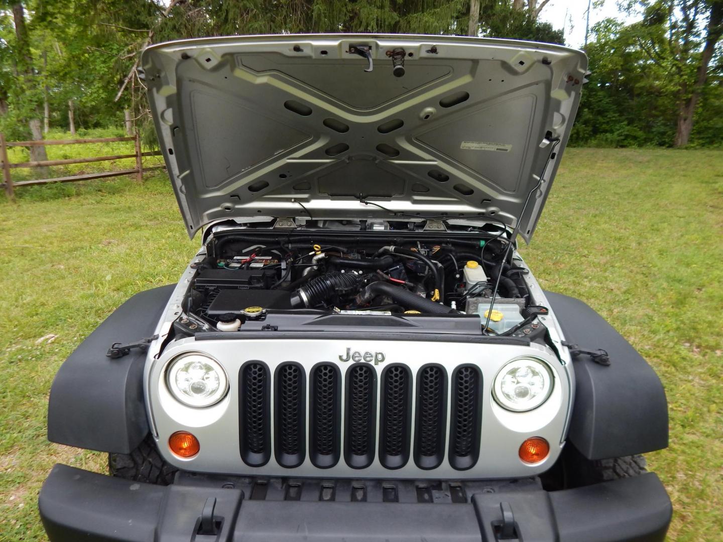 2011 Silver /Black Jeep Wrangler Sport 4WD (1J4AA2D12BL) with an 3.8L V6 OHV 12V engine, Automatic transmission, located at 6528 Lower York Road, New Hope, PA, 18938, (215) 862-9555, 40.358707, -74.977882 - Here we have a 2011 Jeep Wrangler Sport with a 3.8L V6 putting power to an automatic 4x4 transmission. Options include: black cloth, heat and AC, JVC aftermarket radio, cruise control, tilt steering wheel, 3 piece hard top, power windows/locks/mirrors, 17 inch alloy wheels with 4 Goodyear Wrangler t - Photo#19