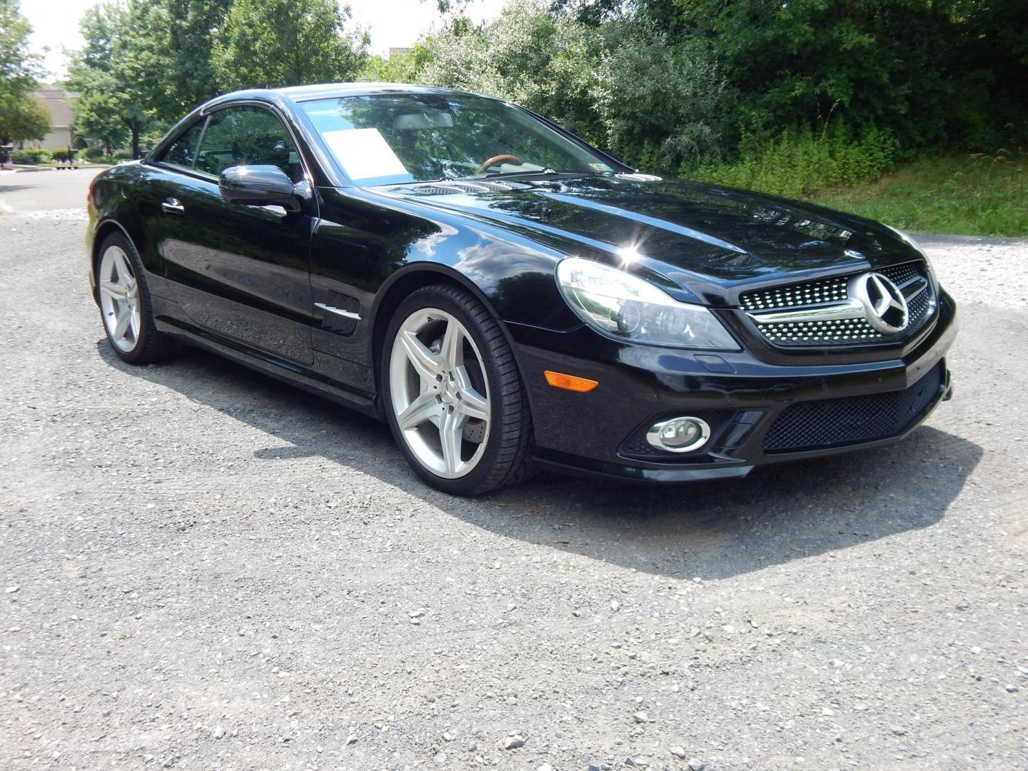 2009 Black /Black Mercedes-Benz SL-Class SL550 (WDBSK71F99F) with an 5.5L V8 DOHC 32V engine, 7-Speed Automatic transmission, located at 6528 Lower York Road, New Hope, PA, 18938, (215) 862-9555, 40.358707, -74.977882 - Here we have a Mercedes SL500 convertible with a 5.5L V8 putting power to the rear wheels via an automatic transmission. Options include: black leather with wood trim, heated and cooled seats, air scarf, power seats, dual climate controls, AM/FM/CD/SAT/AUX radio with navigation, power tilt steering - Photo#8