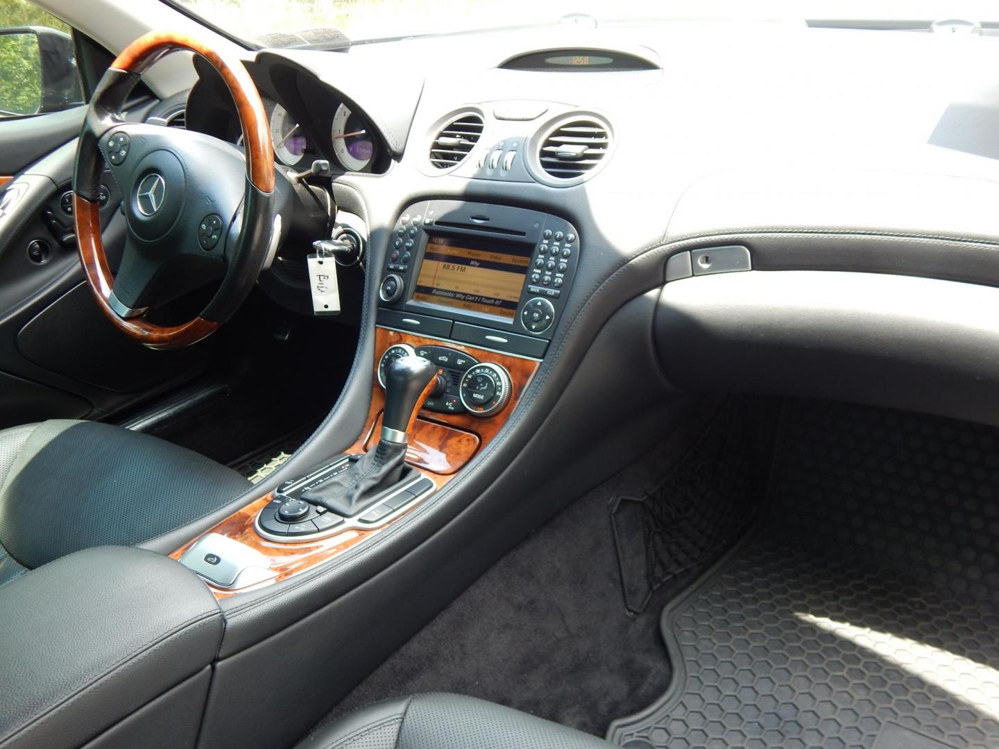 2009 Black /Black Mercedes-Benz SL-Class SL550 (WDBSK71F99F) with an 5.5L V8 DOHC 32V engine, 7-Speed Automatic transmission, located at 6528 Lower York Road, New Hope, PA, 18938, (215) 862-9555, 40.358707, -74.977882 - Here we have a Mercedes SL500 convertible with a 5.5L V8 putting power to the rear wheels via an automatic transmission. Options include: black leather with wood trim, heated and cooled seats, air scarf, power seats, dual climate controls, AM/FM/CD/SAT/AUX radio with navigation, power tilt steering - Photo#16