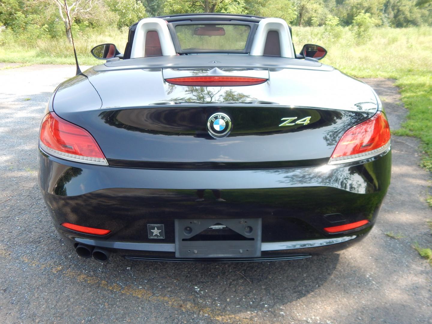 2013 Black /Red BMW Z4 sDrive28i (WBALL5C59DE) with an 2.0L L4 DOHC 16V TURBO engine, Manual transmission, located at 6528 Lower York Road, New Hope, PA, 18938, (215) 862-9555, 40.358707, -74.977882 - Here we have a BMW Z4 convertible with a 2.0L inline 4 cylinder turbo engine cutting power to the rear wheels via a 6 speed manual transmission. Options include: red leather, AM/FM/SIR/AUX radio, dual climate controls, heated seats, dual power seats, push button start, automatic headlights, cruise c- Photo#10