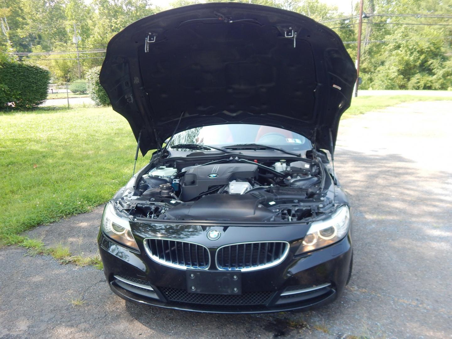 2013 Black /Red BMW Z4 sDrive28i (WBALL5C59DE) with an 2.0L L4 DOHC 16V TURBO engine, Manual transmission, located at 6528 Lower York Road, New Hope, PA, 18938, (215) 862-9555, 40.358707, -74.977882 - Here we have a BMW Z4 convertible with a 2.0L inline 4 cylinder turbo engine cutting power to the rear wheels via a 6 speed manual transmission. Options include: red leather, AM/FM/SIR/AUX radio, dual climate controls, heated seats, dual power seats, push button start, automatic headlights, cruise c- Photo#19