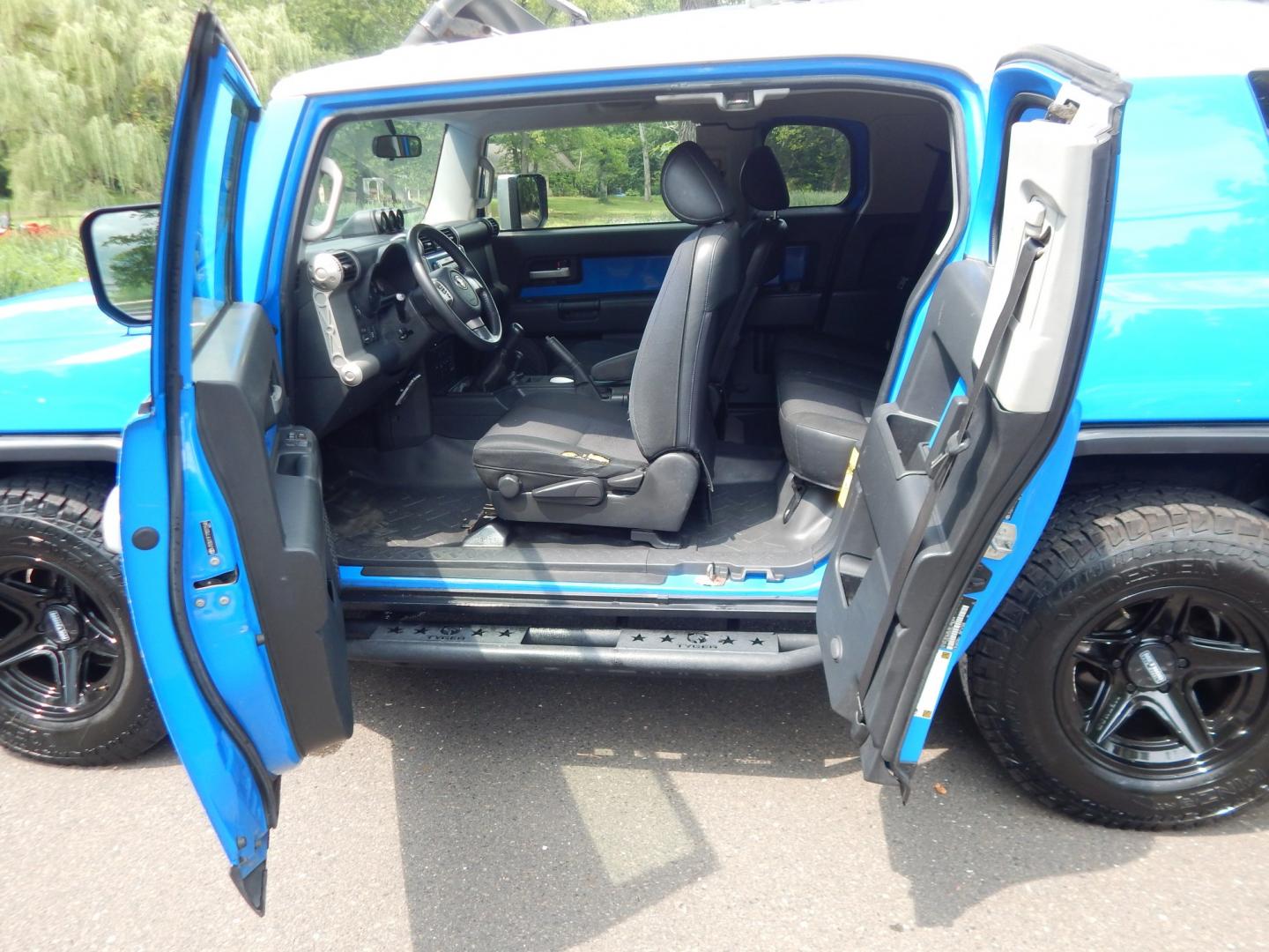 2007 Blue /Black Toyota FJ Cruiser 4WD (JTEBU11F770) with an 4.0L V6 engine, Manual transmission, located at 6528 Lower York Road, New Hope, PA, 18938, (215) 862-9555, 40.358707, -74.977882 - Here we have a very cool FJ cruiser with a 4.0L V6 putting power to all four wheels via a 6 speed manual transmission. Options include: black cloth seats, manual moving seats, AC, heat, AM/FM/CD/AUX/SAT radio, cruise control, tilt steering wheel, power windows/locks/mirrors, roof rack, rear ladder,- Photo#13