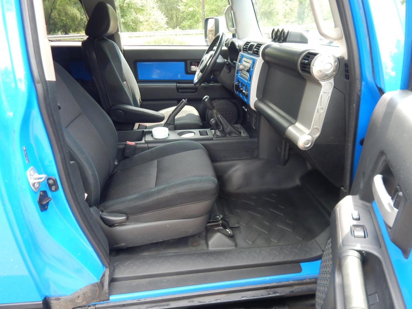 2007 Blue /Black Toyota FJ Cruiser 4WD (JTEBU11F770) with an 4.0L V6 engine, Manual transmission, located at 6528 Lower York Road, New Hope, PA, 18938, (215) 862-9555, 40.358707, -74.977882 - Here we have a very cool FJ cruiser with a 4.0L V6 putting power to all four wheels via a 6 speed manual transmission. Options include: black cloth seats, manual moving seats, AC, heat, AM/FM/CD/AUX/SAT radio, cruise control, tilt steering wheel, power windows/locks/mirrors, roof rack, rear ladder,- Photo#16