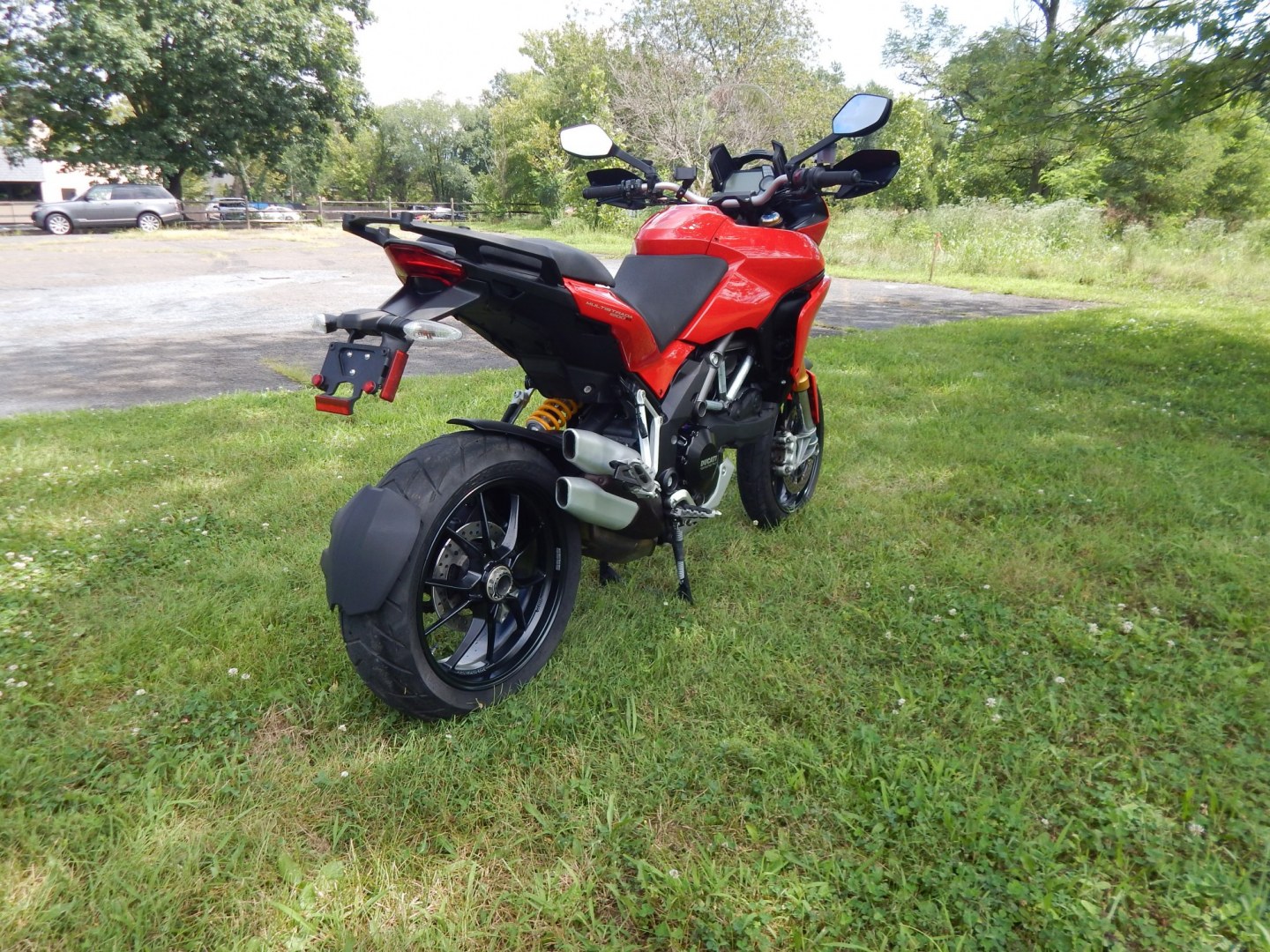 2012 Red /Black Ducati Multistrada 1200 S-Touring (ZDM12BLW5CB) with an 1198CC engine, Manual transmission, located at 6528 Lower York Road, New Hope, PA, 18938, (215) 862-9555, 40.358707, -74.977882 - Here we have a one owner Ducati Multistrada 1200 S-Touring with 1,999 original miles! This Ducati has a 1198cc L-twin engine putting power to the rear tire via a manual shifting transmission. Being a S-Touring bike, it comes with a center stand, heated grips and 2 hard luggage cases. Other options i- Photo#3