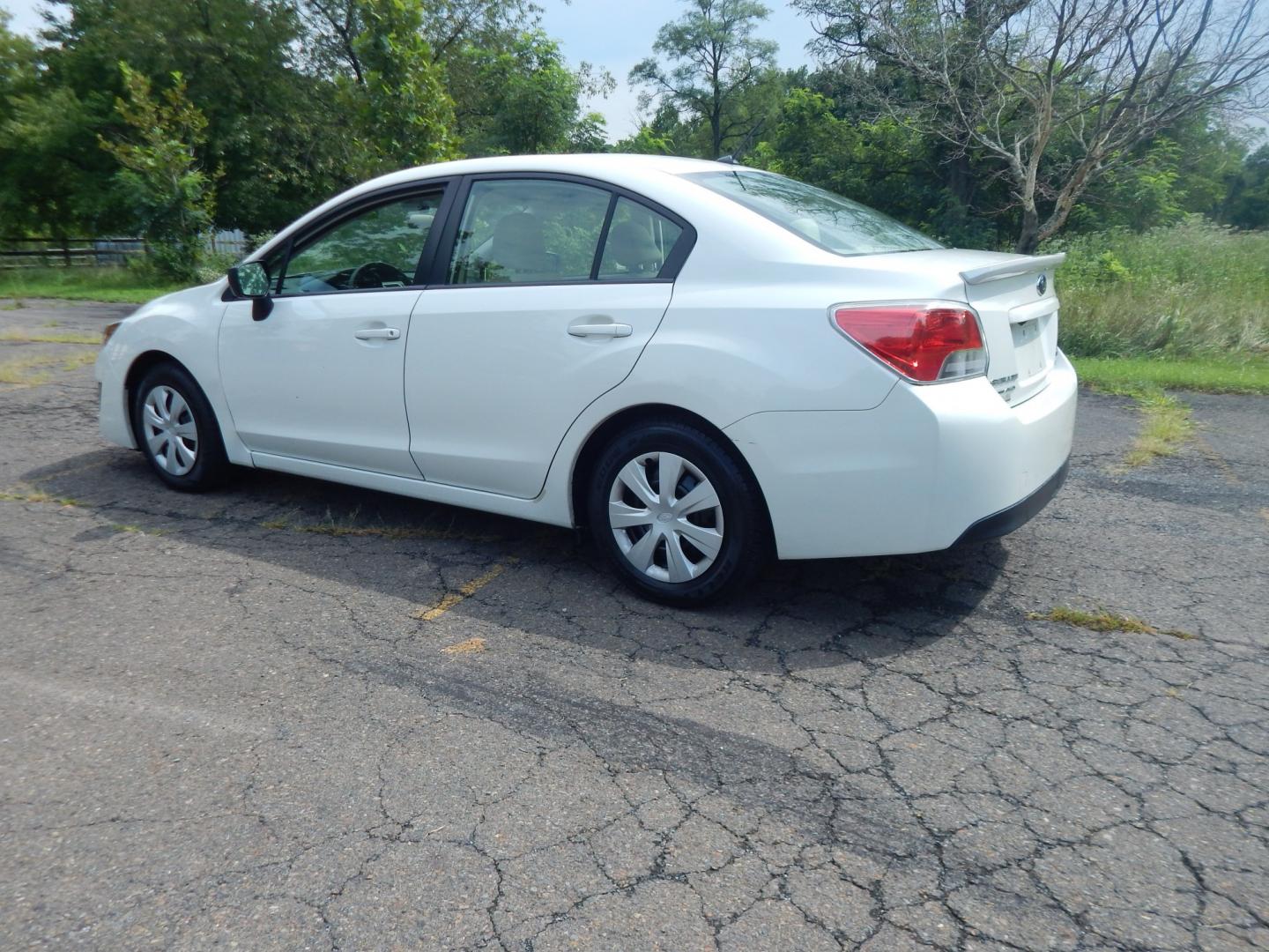 2015 White /Tan Subaru Impreza 2.0i PZEV CVT 4-Door (JF1GJAA60FH) with an 2.0L H4 DOHC 16V engine, CVT transmission, located at 6528 Lower York Road, New Hope, PA, 18938, (215) 862-9555, 40.358707, -74.977882 - Here we have a Subaru Impreza with a 2.0L H4 engine putting power to all four wheels via an automatic transmission. Options include: tan cloth, heat, AC, am/fm/disc/bluetooth/aux radio with back up camera, cruise control, power windows/locks/mirrors and tilt steering wheel. Pa inspection good until- Photo#2