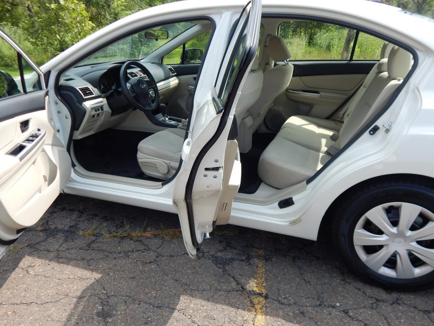 2015 White /Tan Subaru Impreza 2.0i PZEV CVT 4-Door (JF1GJAA60FH) with an 2.0L H4 DOHC 16V engine, CVT transmission, located at 6528 Lower York Road, New Hope, PA, 18938, (215) 862-9555, 40.358707, -74.977882 - Here we have a Subaru Impreza with a 2.0L H4 engine putting power to all four wheels via an automatic transmission. Options include: tan cloth, heat, AC, am/fm/disc/bluetooth/aux radio with back up camera, cruise control, power windows/locks/mirrors and tilt steering wheel. Pa inspection good until- Photo#12