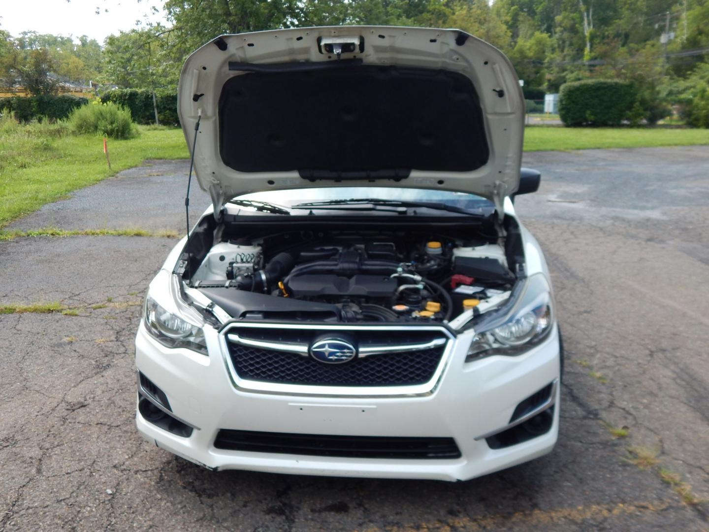 2015 White /Tan Subaru Impreza 2.0i PZEV CVT 4-Door (JF1GJAA60FH) with an 2.0L H4 DOHC 16V engine, CVT transmission, located at 6528 Lower York Road, New Hope, PA, 18938, (215) 862-9555, 40.358707, -74.977882 - Here we have a Subaru Impreza with a 2.0L H4 engine putting power to all four wheels via an automatic transmission. Options include: tan cloth, heat, AC, am/fm/disc/bluetooth/aux radio with back up camera, cruise control, power windows/locks/mirrors and tilt steering wheel. Pa inspection good until- Photo#18